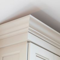 beautiful woodworking on cabinet