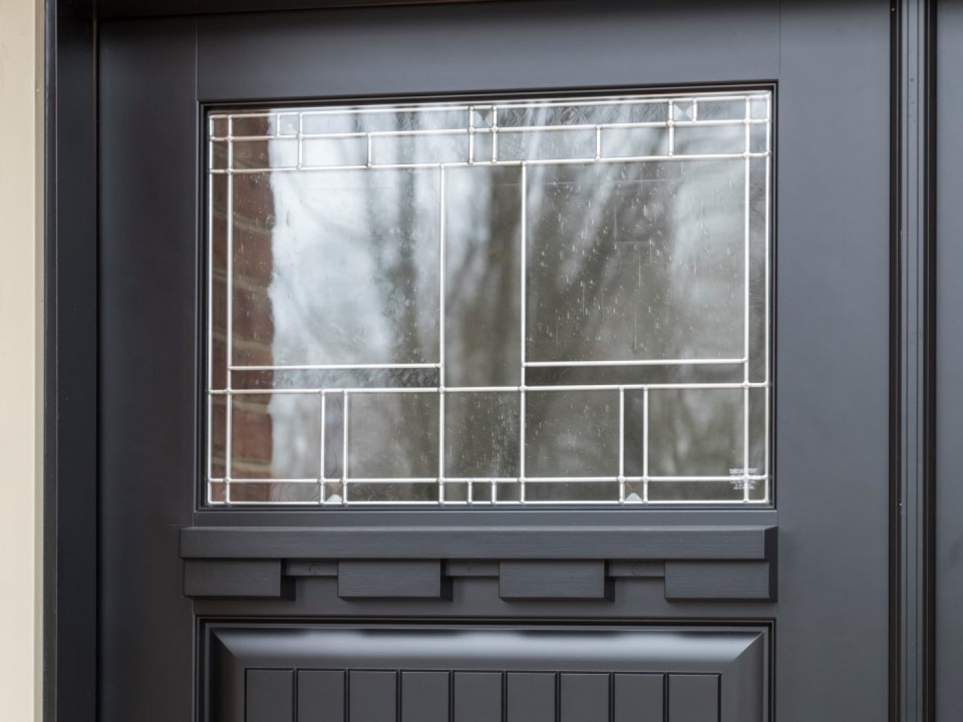 black door and patterned window