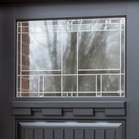 black door and patterned window