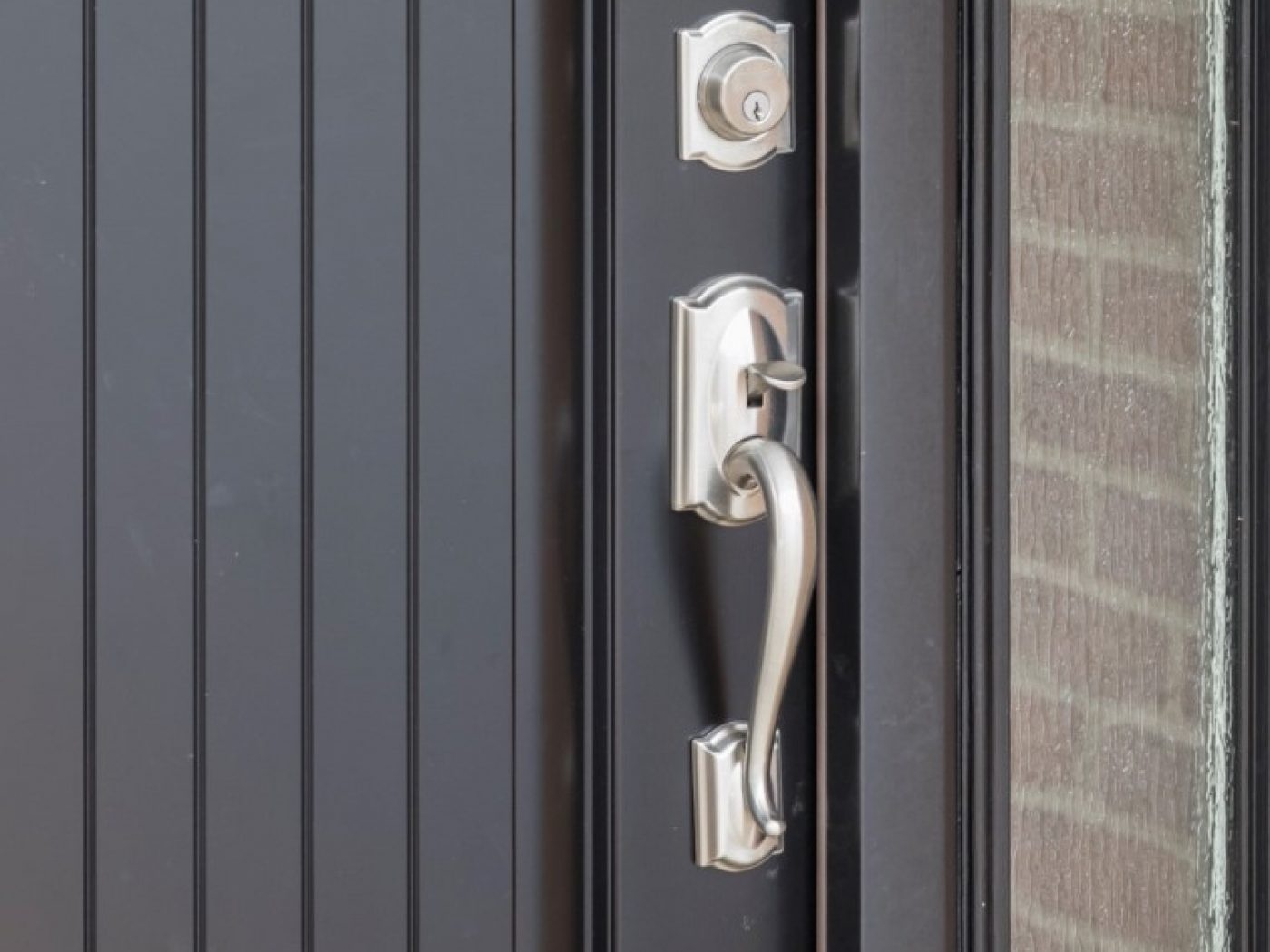 silver door on black handle