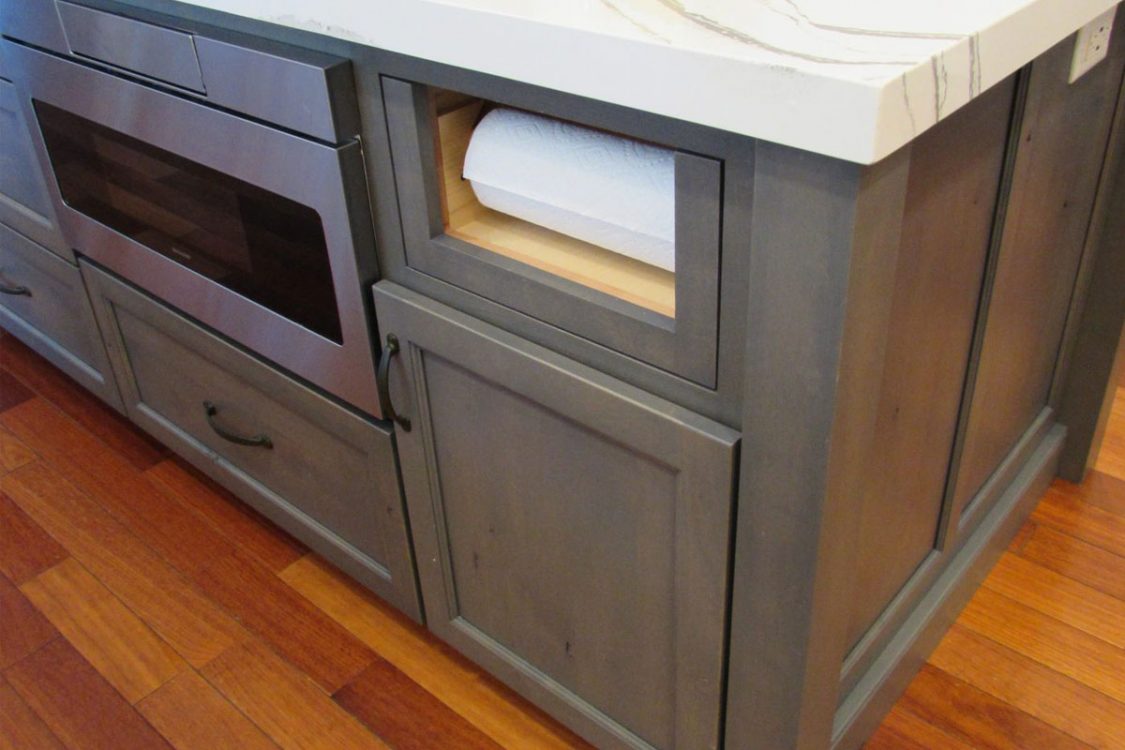 Gray custom cabinets with secret storage