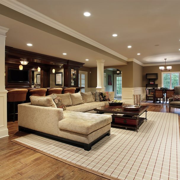 Elegant basement remodel with bar