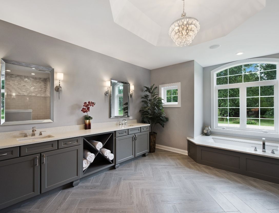 Spa bathroom remodeled with gray floors and walls