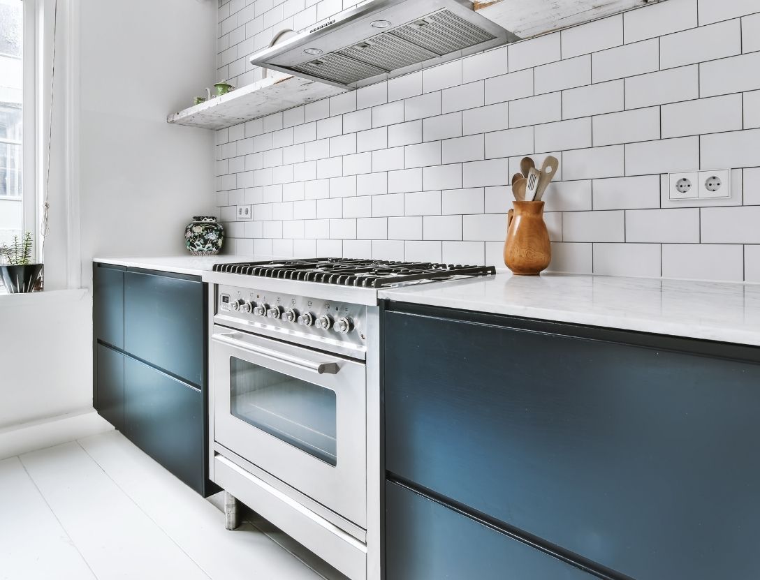 Navy cabinets with subway tile backsplash