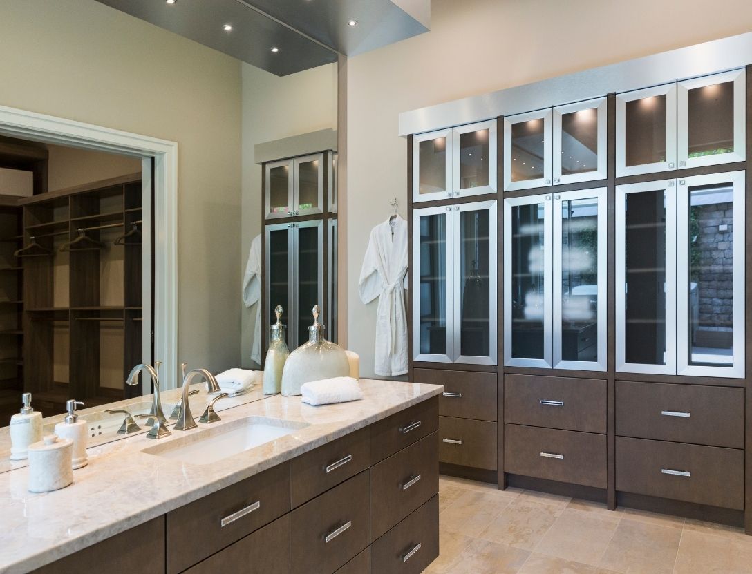 Large master bathroom remodeled with linen cabinet