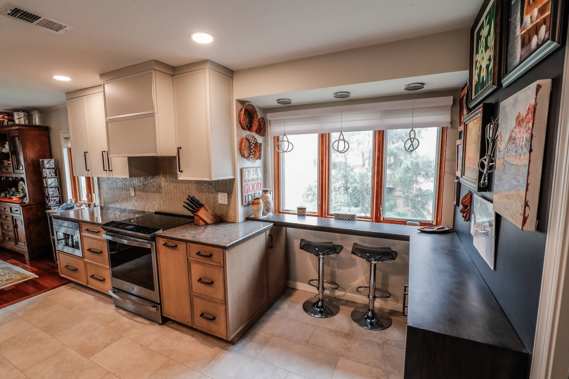 three large windows in the front of a bar in a spacious kitchen remodel