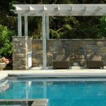 white poolside vinyl pergola installation